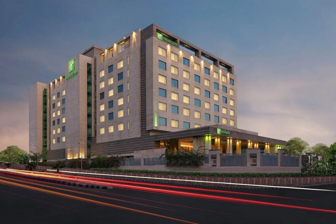 Holiday Inn Jaipur City Centre — hotel exterior at dusk