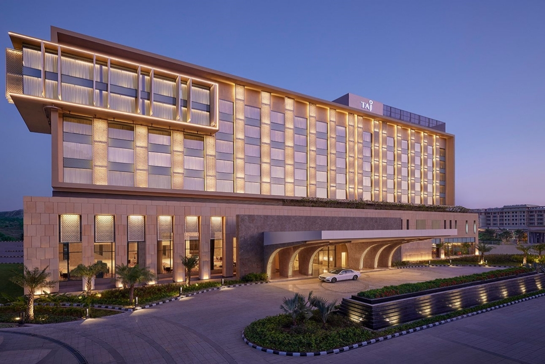 Taj Amer, Jaipur — illuminated hotel facade and entrance at dusk