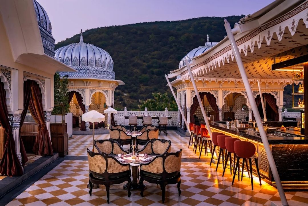 Rooftop bar with Aravalli hill views at The Leela Palace Jaipur