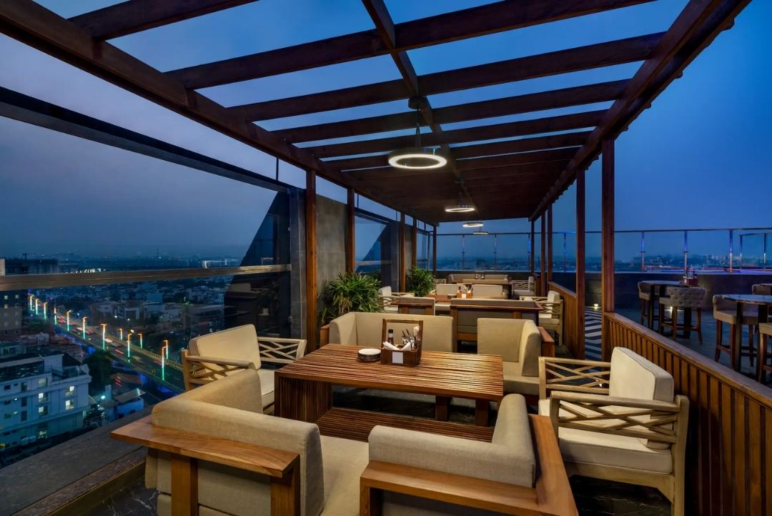 Rooftop restaurant at dusk — Hilton Jaipur