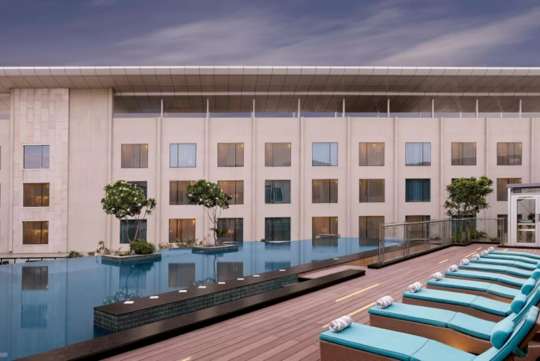 InterContinental Jaipur Tonk Road — rooftop pool with sun loungers