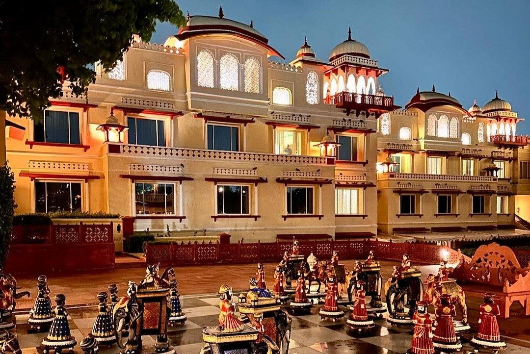 The illuminated palace façade at dusk — Jai Mahal Palace, Jaipur