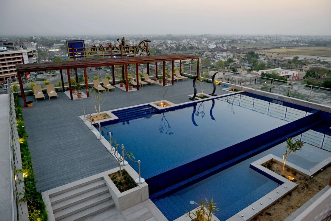 Rooftop swimming pool with skyline views — Radisson Blu Jaipur