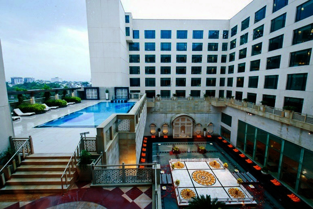 Courtyard pool and hotel — The LaLiT Jaipur