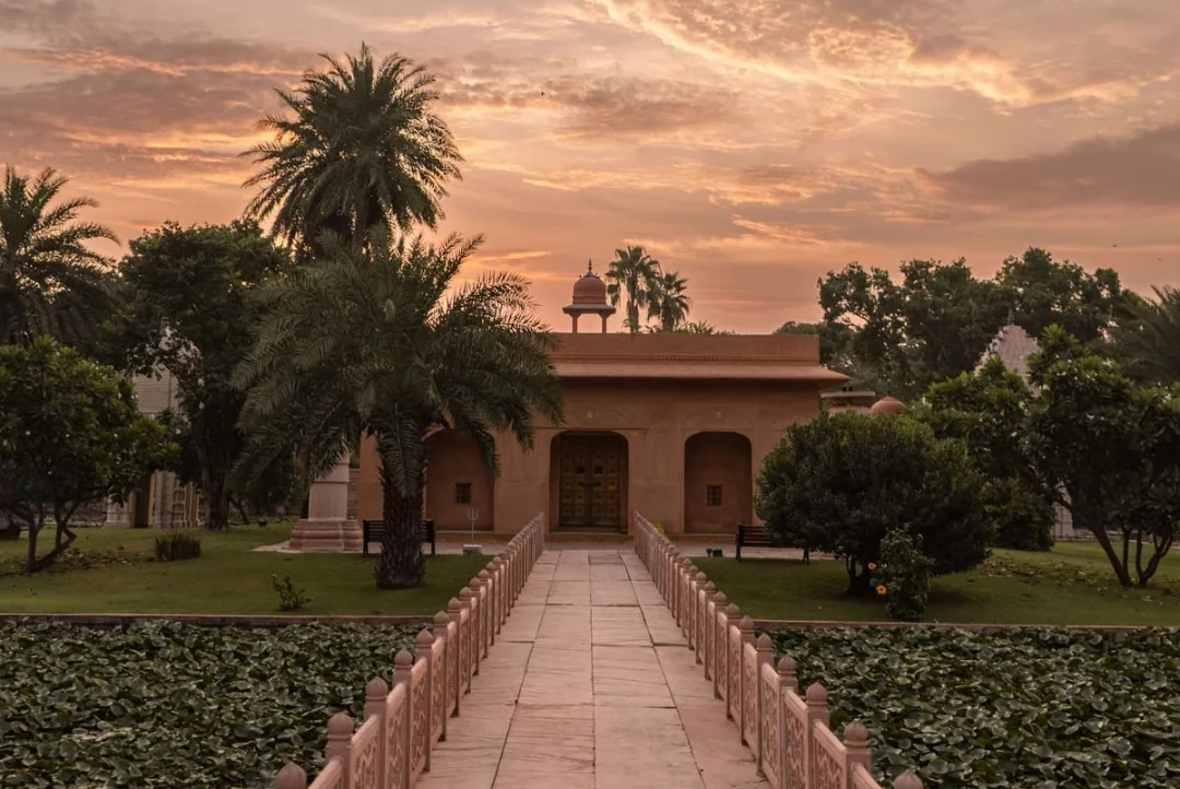 The Oberoi Rajvilas, Jaipur — garden pavilion and lotus pond at sunset
