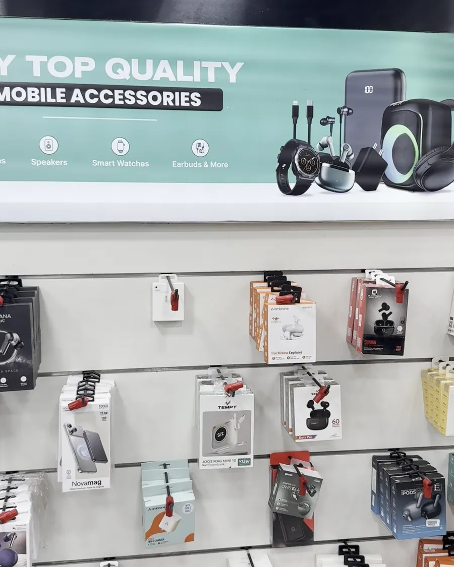 Earbuds, chargers and other mobile accessories on a wall at the Cashify store