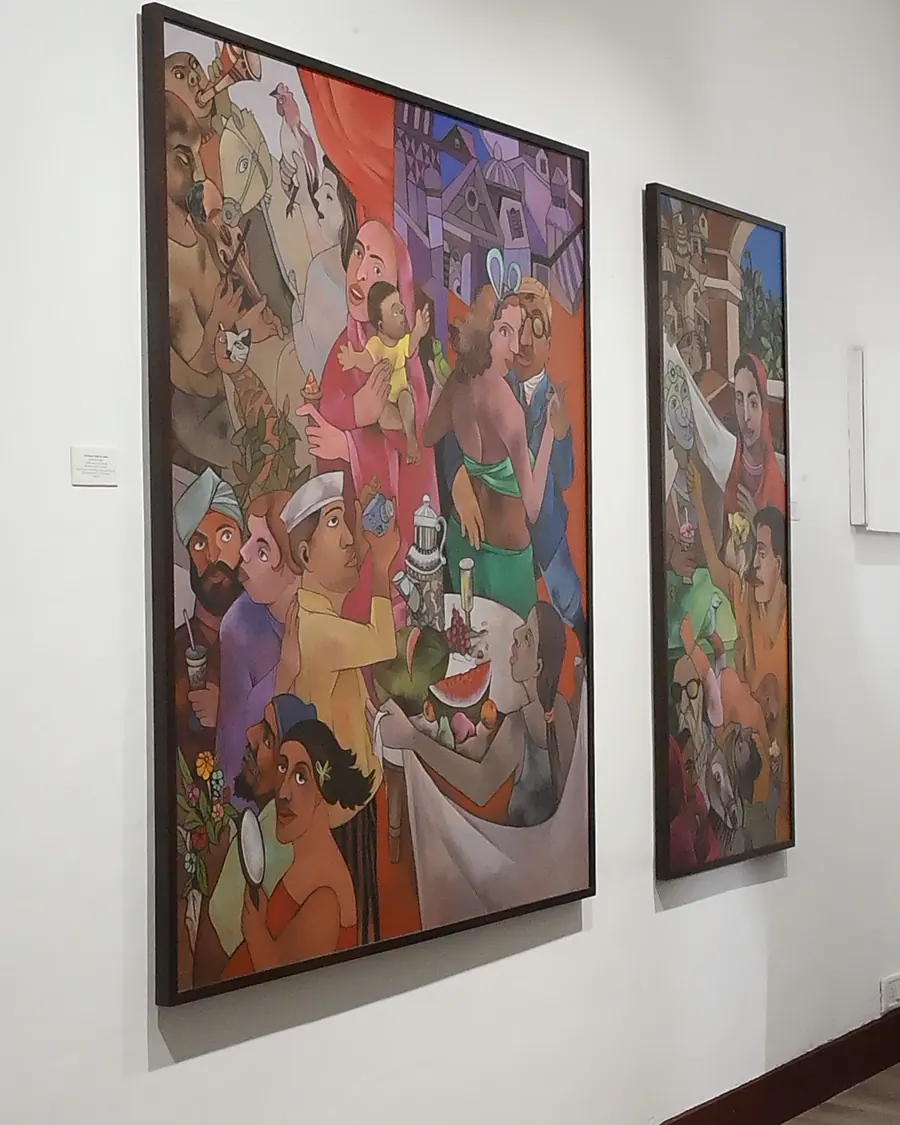 Large, colourful figurative canvases on a white wall at ICA Gallery