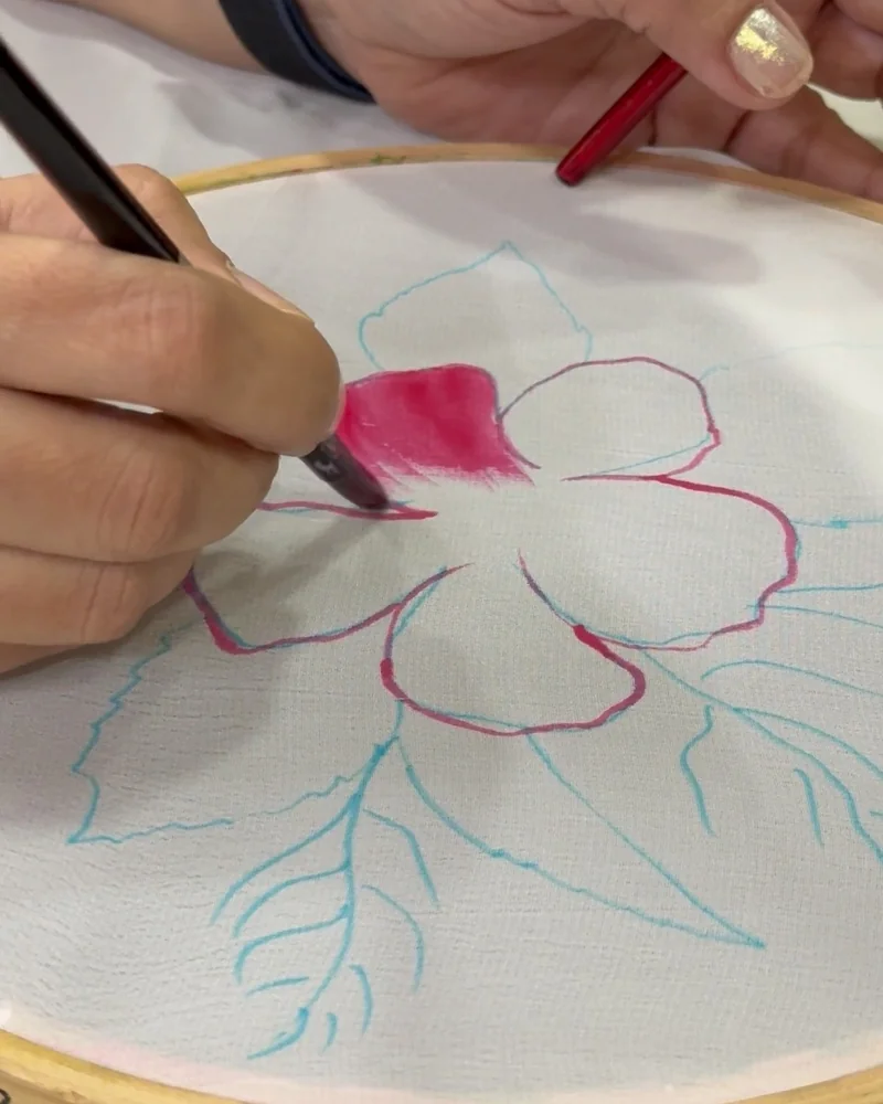 Filling in pink petals with a brush